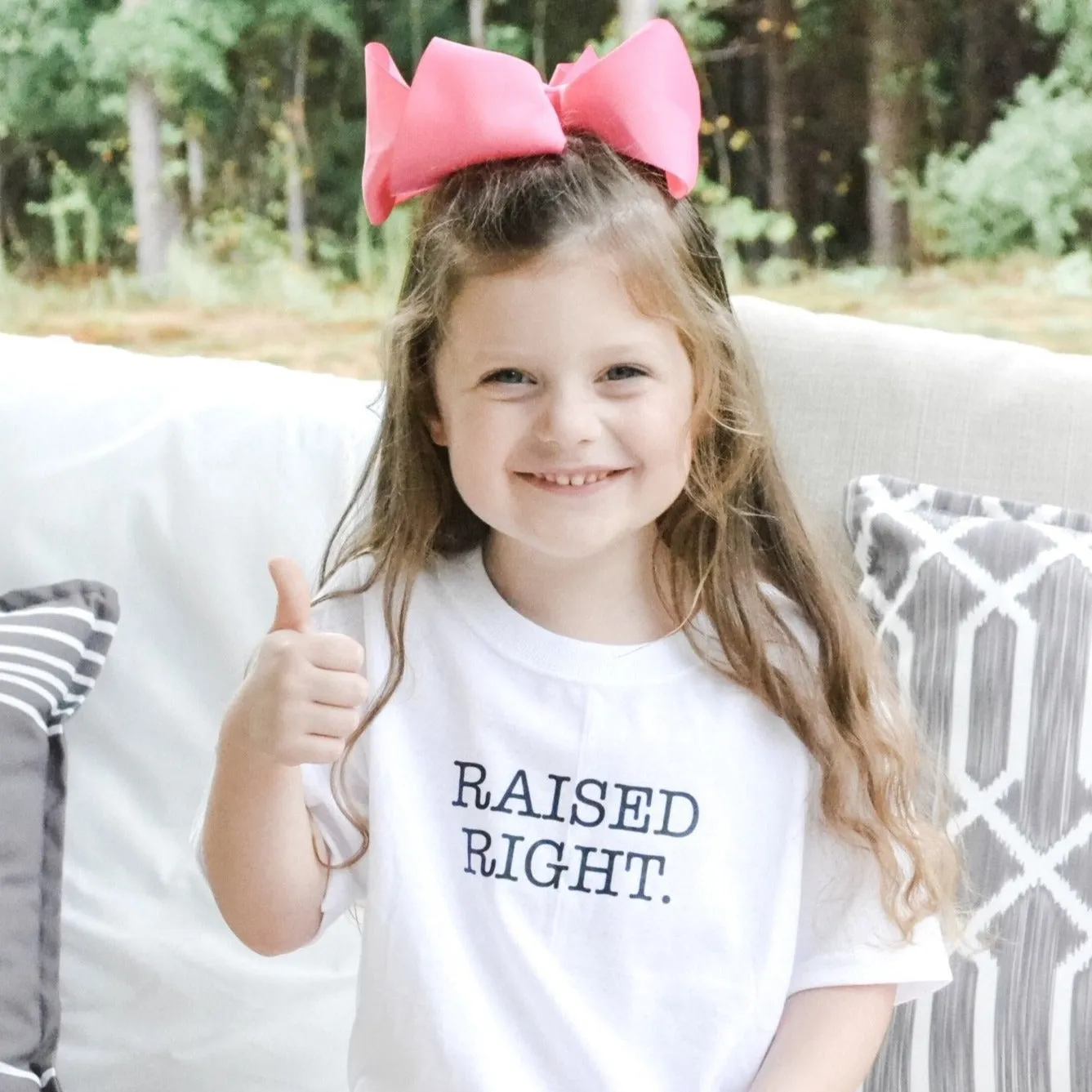 The Raised Right Onesie and T-shirt